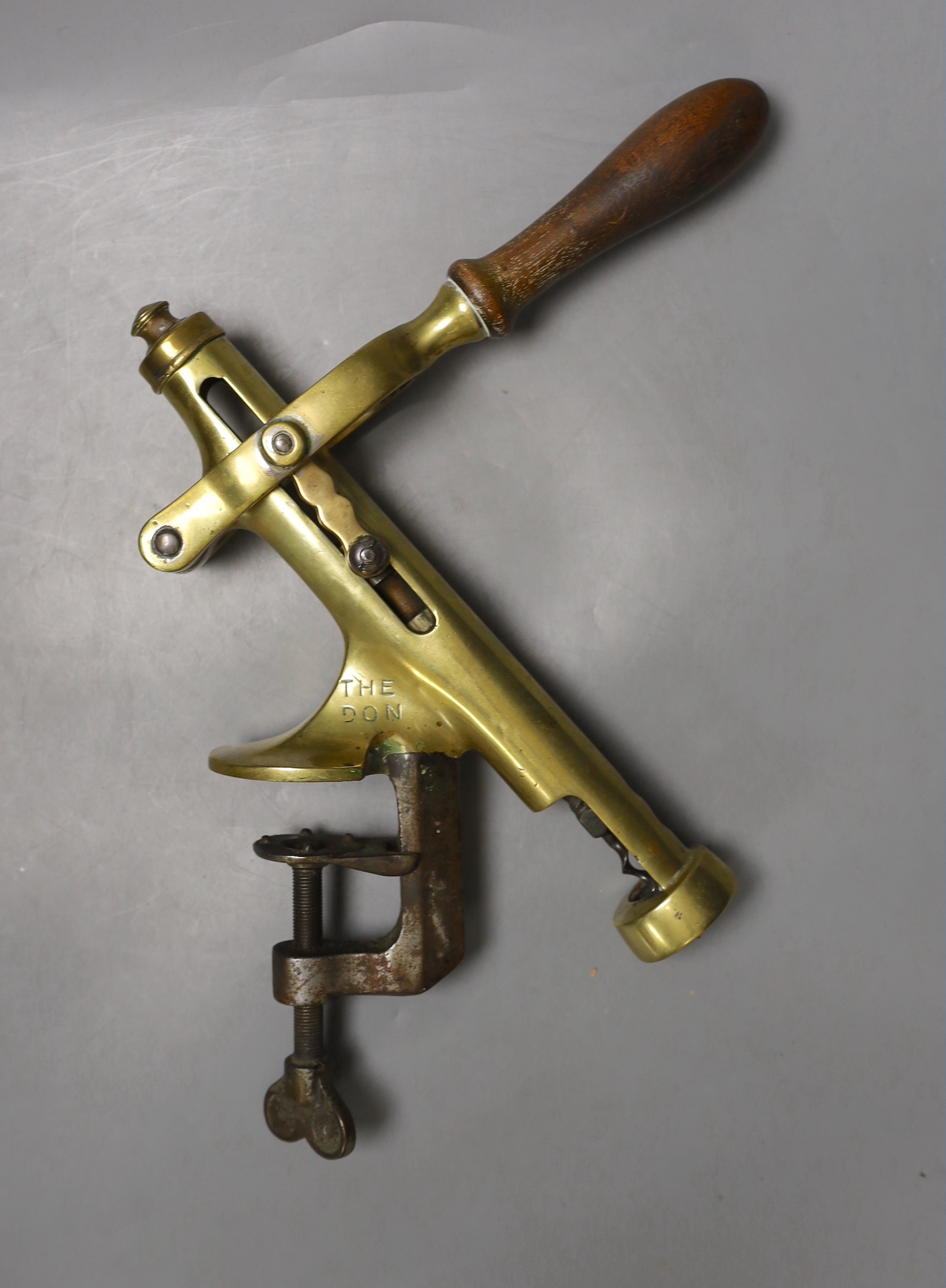 A Chambers patent bar mounting brass clamp corkscrew marked ‘THE DON’ with turned beech handle